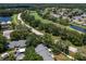 Aerial view of condo community near a road and lush landscaping at 3856 Goldfinch Ct, Palm Harbor, FL 34685