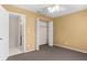 Bright bedroom with spacious closet and neutral carpeting at 3856 Goldfinch Ct, Palm Harbor, FL 34685