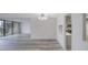 Spacious living area featuring mirrored walls and hardwood floors at 400 Island Way # 308, Clearwater, FL 33767