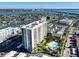 High-rise building with pool and surrounding neighborhood view at 400 Island Way # 308, Clearwater, FL 33767
