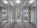 Bathroom with mirrored closets and grey carpet flooring at 400 Island Way # 308, Clearwater, FL 33767