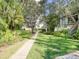 Well-manicured grounds with lush landscaping and walkways at 400 Island Way # 308, Clearwater, FL 33767