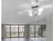 Living room with mirrored wall and sliding glass doors at 400 Island Way # 308, Clearwater, FL 33767