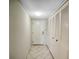 Neutral hallway with tile flooring, leading to bedrooms and closets at 400 Island Way # 308, Clearwater, FL 33767