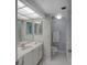 Updated bathroom with a vanity, toilet, and shower at 400 Island Way # 308, Clearwater, FL 33767