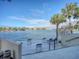 Relaxing waterfront deck with chairs, offering scenic water views at 400 Island Way # 308, Clearwater, FL 33767