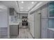 Updated kitchen with gray cabinets, stainless steel appliances, and quartz countertops at 400 Island Way # 308, Clearwater, FL 33767