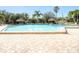 Refreshing community pool area with surrounding patio at 400 Island Way # 308, Clearwater, FL 33767