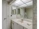 Bright bathroom featuring a vanity and large mirror at 400 Island Way # 308, Clearwater, FL 33767
