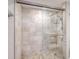 Walk-in shower with glass enclosure and tile surround at 400 Island Way # 308, Clearwater, FL 33767