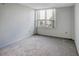 Bright bedroom with large window and neutral carpeting at 400 Island Way # 308, Clearwater, FL 33767