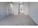 Bright bedroom with carpet and access to bathroom and closets at 400 Island Way # 308, Clearwater, FL 33767