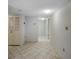 Clean and bright hallway with tile flooring and neutral-colored walls at 400 Island Way # 308, Clearwater, FL 33767
