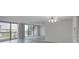 Bright living room with balcony access and mirrored wall at 400 Island Way # 308, Clearwater, FL 33767