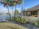 Private waterfront patio with grilling area and lush landscaping at 400 Island Way # 308, Clearwater, FL 33767