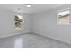 Bright bedroom with tile floors and large window at 6840 Runnel Dr, New Port Richey, FL 34653