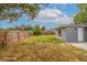 Backyard view of home with grassy area at 6840 Runnel Dr, New Port Richey, FL 34653