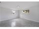 Spacious bedroom with large windows and tile floors at 6840 Runnel Dr, New Port Richey, FL 34653