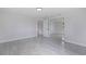 Bright bedroom with mirrored closet and tile floors at 6840 Runnel Dr, New Port Richey, FL 34653