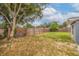 Large backyard with wooden fence at 6840 Runnel Dr, New Port Richey, FL 34653