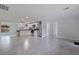 Open concept kitchen with stainless steel appliances and light cabinets at 6840 Runnel Dr, New Port Richey, FL 34653