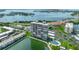 Aerial view of waterfront highrise condo building with pool and marina at 7300 Sun Island S Dr # 1102, South Pasadena, FL 33707