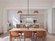 Modern kitchen with island and dining area at 126 4Th Ne Ave # 1202, St Petersburg, FL 33701