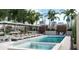 Relaxing pool area with lounge chairs and umbrellas at 126 4Th Ne Ave # 1202, St Petersburg, FL 33701