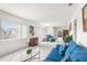 Living room with blue sofas and a view of the patio at 4445 Pelorus Dr, New Port Richey, FL 34652