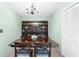 Bright dining room with built-in hutch and wood table at 4445 Pelorus Dr, New Port Richey, FL 34652