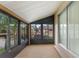 Spacious screened porch with pebble flooring at 4445 Pelorus Dr, New Port Richey, FL 34652