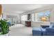 Spacious living room with ample natural light and blue sofa at 4445 Pelorus Dr, New Port Richey, FL 34652