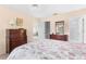 Primary bedroom with coral bedding and wood furniture at 4445 Pelorus Dr, New Port Richey, FL 34652