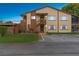 Two-story building with brown accents and outdoor stairs at 4445 Pelorus Dr, New Port Richey, FL 34652