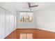 Bright bedroom featuring hardwood floors and ample closet space at 1 Seaside Ln # 104, Belleair, FL 33756