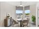 Breakfast nook with water views and modern table and chairs at 1 Seaside Ln # 104, Belleair, FL 33756