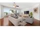 Spacious living room with hardwood floors and water views at 1 Seaside Ln # 104, Belleair, FL 33756