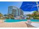 Resort-style pool and spa with ample seating for relaxation at 1 Seaside Ln # 104, Belleair, FL 33756