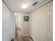 Hallway with linen closets and bathroom access at 7537 Bayshore Dr # 303, Treasure Island, FL 33706