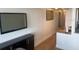 Bright hallway with mounted TV and view into the kitchen at 2506 N Rocky Point Dr # 429, Tampa, FL 33607