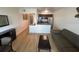 Open living room and kitchen area with light wood floors at 2506 N Rocky Point Dr # 429, Tampa, FL 33607