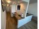 Long hallway with a built-in desk and kitchen pass-through at 2506 N Rocky Point Dr # 429, Tampa, FL 33607