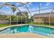 Enjoy this refreshing pool with a screened enclosure at 500 Waterford W Cir, Tarpon Springs, FL 34688