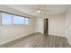 Bright bedroom with wood-look flooring and access to bathroom at 6075 Shore S Blvd # 501, Gulfport, FL 33707