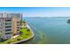 Aerial view of waterfront property with pool and lush landscaping at 6075 Shore S Blvd # 501, Gulfport, FL 33707