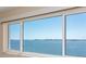 Serene water view from window, showcasing tranquil waters and a distant cityscape at 6075 Shore S Blvd # 501, Gulfport, FL 33707