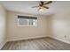Spacious bedroom with wood-look floors and large window at 6075 Shore S Blvd # 501, Gulfport, FL 33707