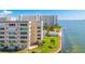 Aerial view of waterfront property with pool and lush landscaping at 6075 Shore S Blvd # 501, Gulfport, FL 33707