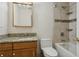 Bathroom boasts granite countertop, updated fixtures, and tile shower/tub at 6075 Shore S Blvd # 501, Gulfport, FL 33707