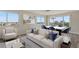 Bright living room features a comfortable sofa and marble dining table at 6075 Shore S Blvd # 501, Gulfport, FL 33707